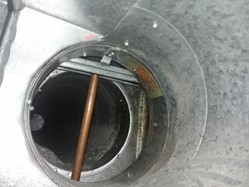 Metal pipe holding up fire damper